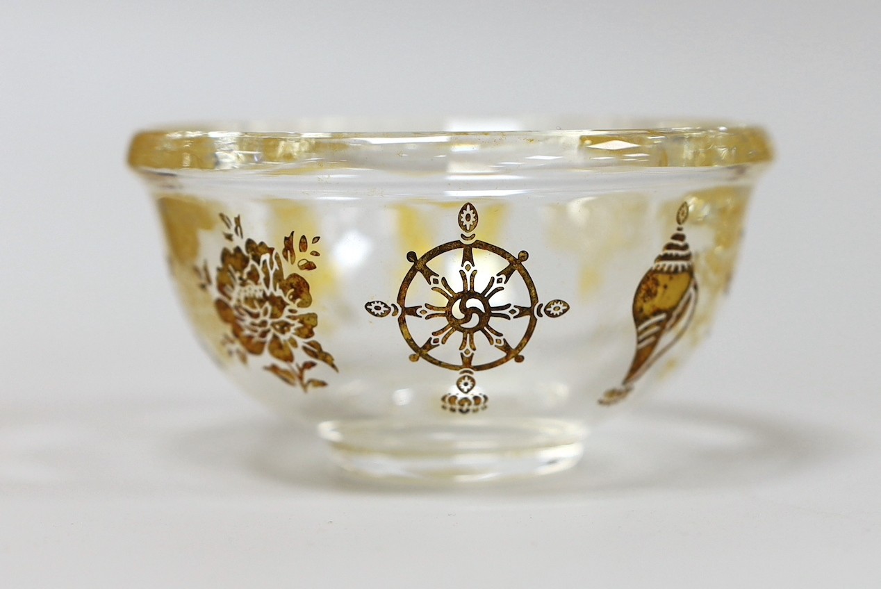 A Tibetan glass gilt decorated 'eight Buddhist emblems' bowl, 9cms diameter